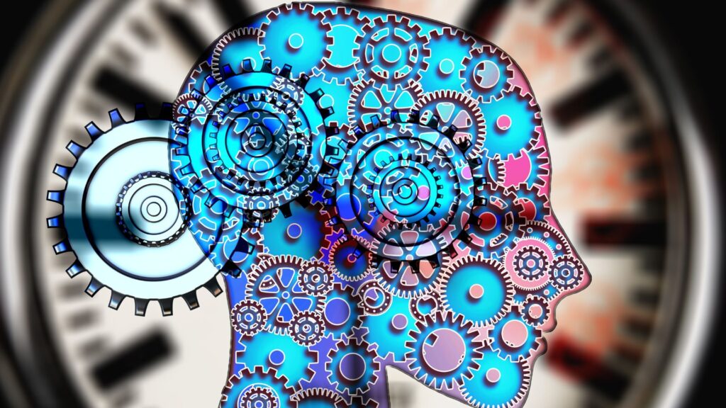 Cérebro com relógio e engrenagens representando os gatilhos mentais